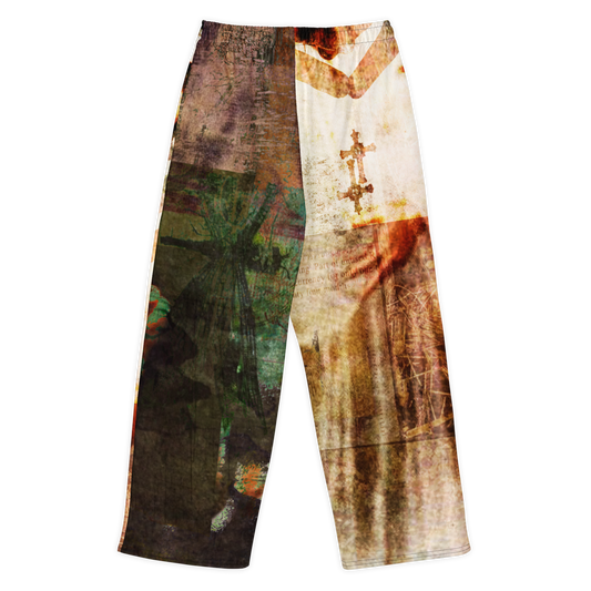 A pair of wide-leg pants featuring a split, distressed graphic print. The left leg displays a dark, textured brown and green abstract design, while the right leg features a vintage-style print of a robed figure with a cross on a cream background, all finished with white side stripes.