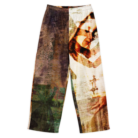 A pair of wide-leg pants with a split design: one leg features a dark brown and green distressed graphic pattern, while the other leg features a vintage-style portrait print in brown, beige, and white tones with a cross graphic.