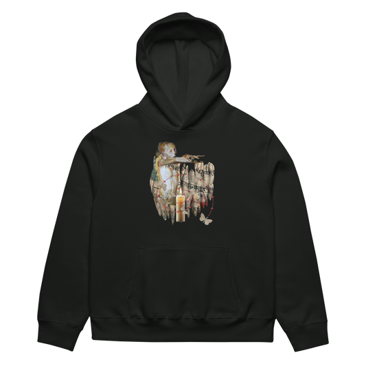 A black pullover hoodie with a detailed vintage-style graphic print on the chest depicting a cherub painting, candles, and butterflies, shown against a plain white background.