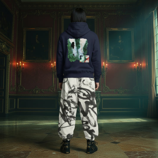 A person standing in a grand, dimly lit historical room, viewed from behind. They are wearing a navy blue hoodie with a large graphic print on the back and loose white sweatpants featuring a black ink sketch pattern.
