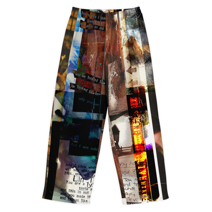 A pair of wide-leg cropped pants featuring a complex, collage-like abstract print with text, brushstrokes, and colorful vertical stripes in black, white, brown, blue, orange, and red, shown against a plain white background.